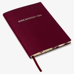 Burgundy notebook with text