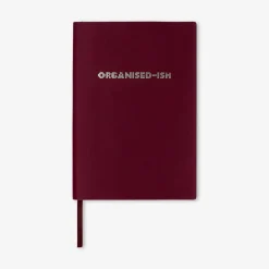 Burgundy notebook with text
