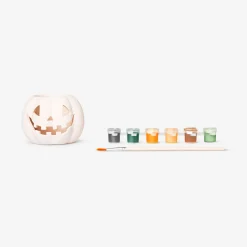 DIY pumpkin tealight holder with paint and brush
