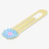 Gold metal ruler with flower