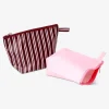 Pink and brown toiletry bags