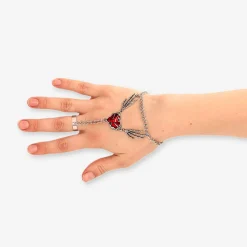 Silver hand jewellery with red heart