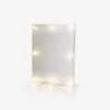 Wall-mounted illuminated mirror